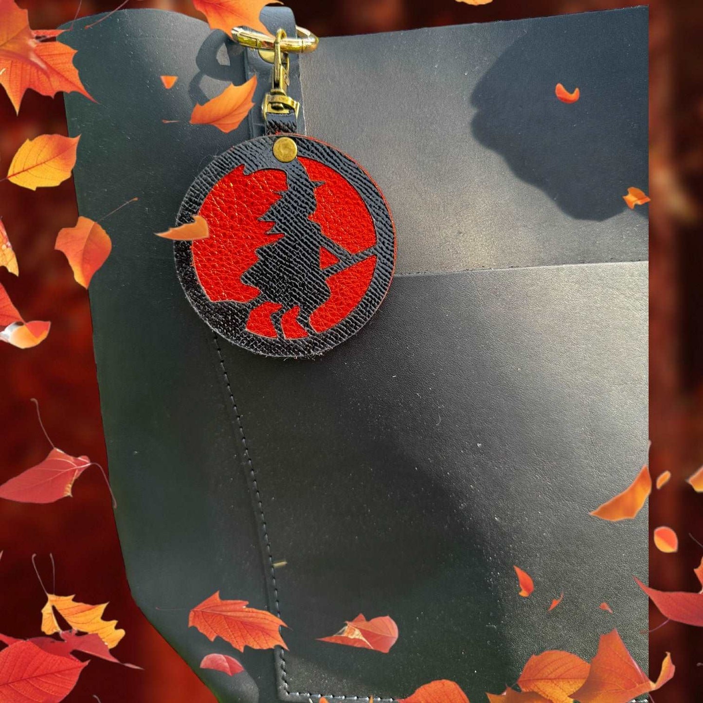 Handcrafted Black Leather Witch Charm with Orange Metallic Background & Lobster Clasp