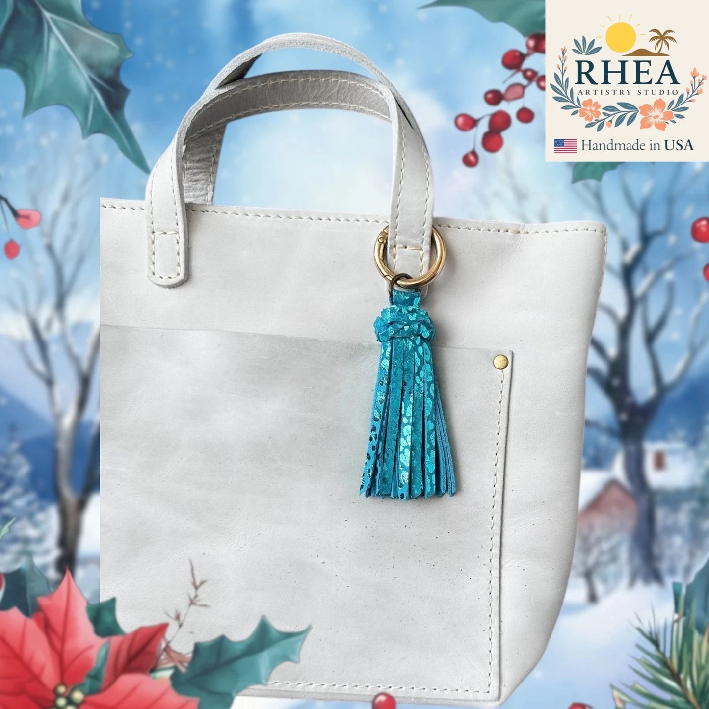 White handbag with a blue tassel on a decorative background featuring Christmas elements.