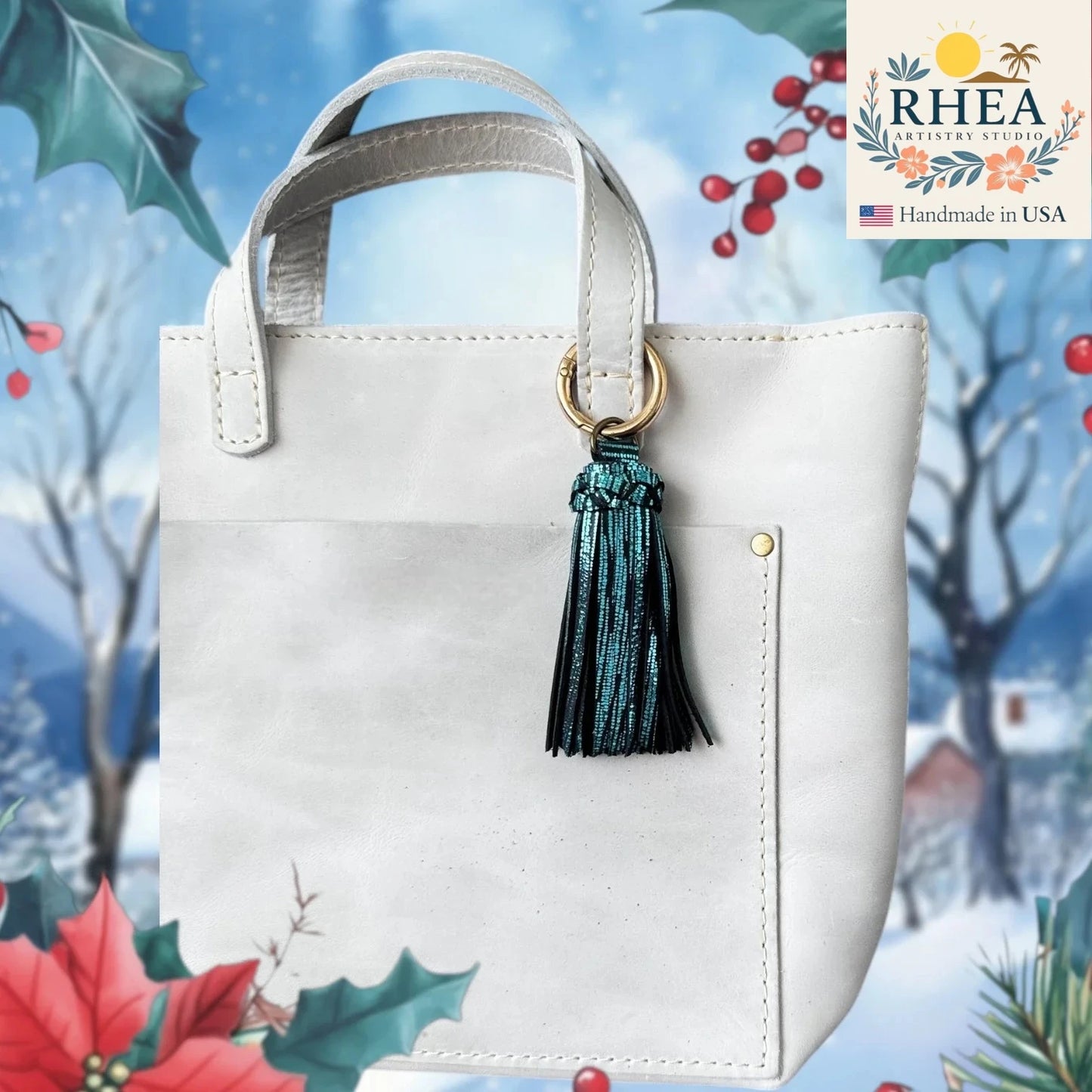 White handbag with a tassel on a decorative background featuring Christmas elements and the RHEA brand.