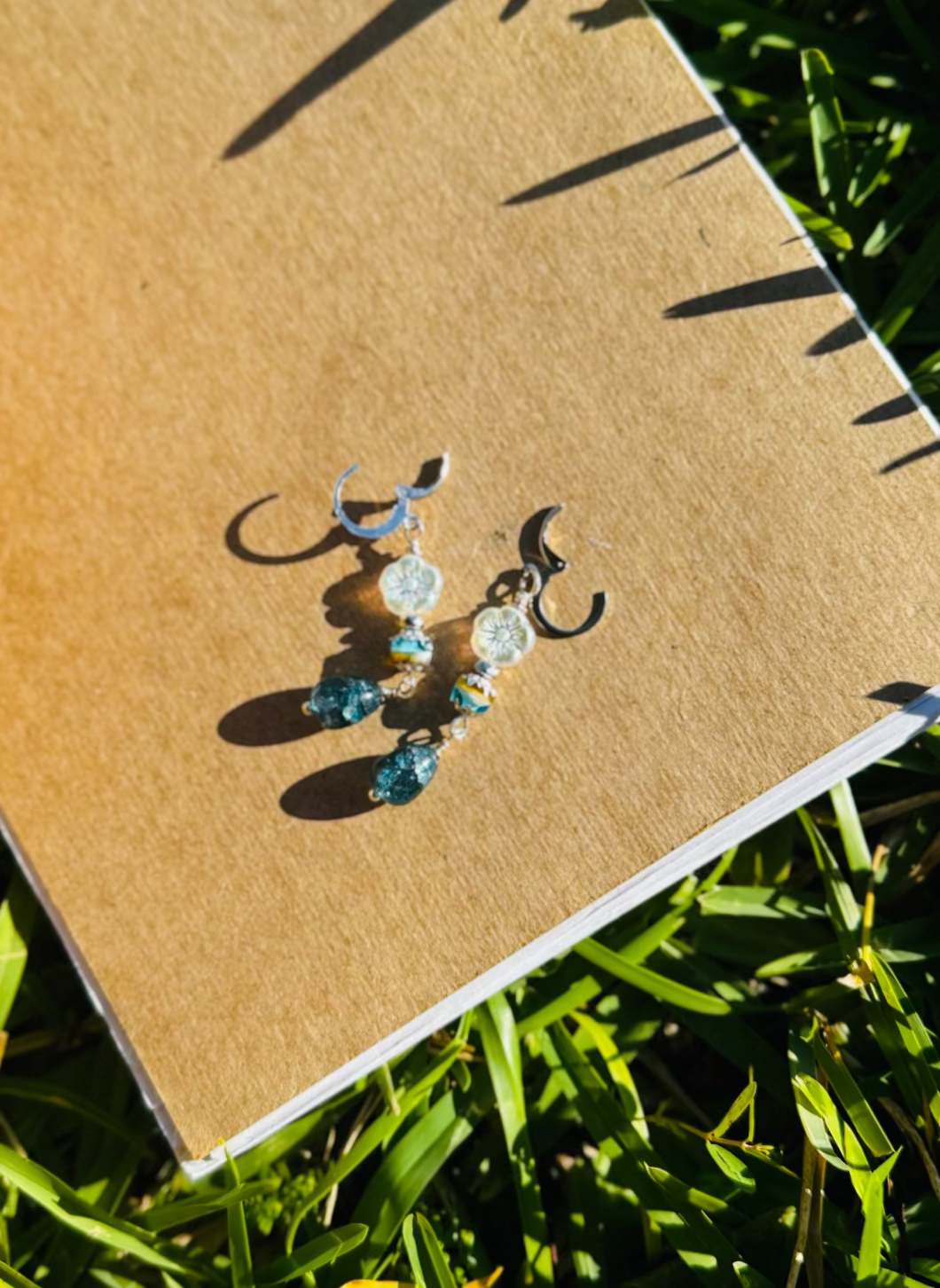 Pair of earrings on a old book