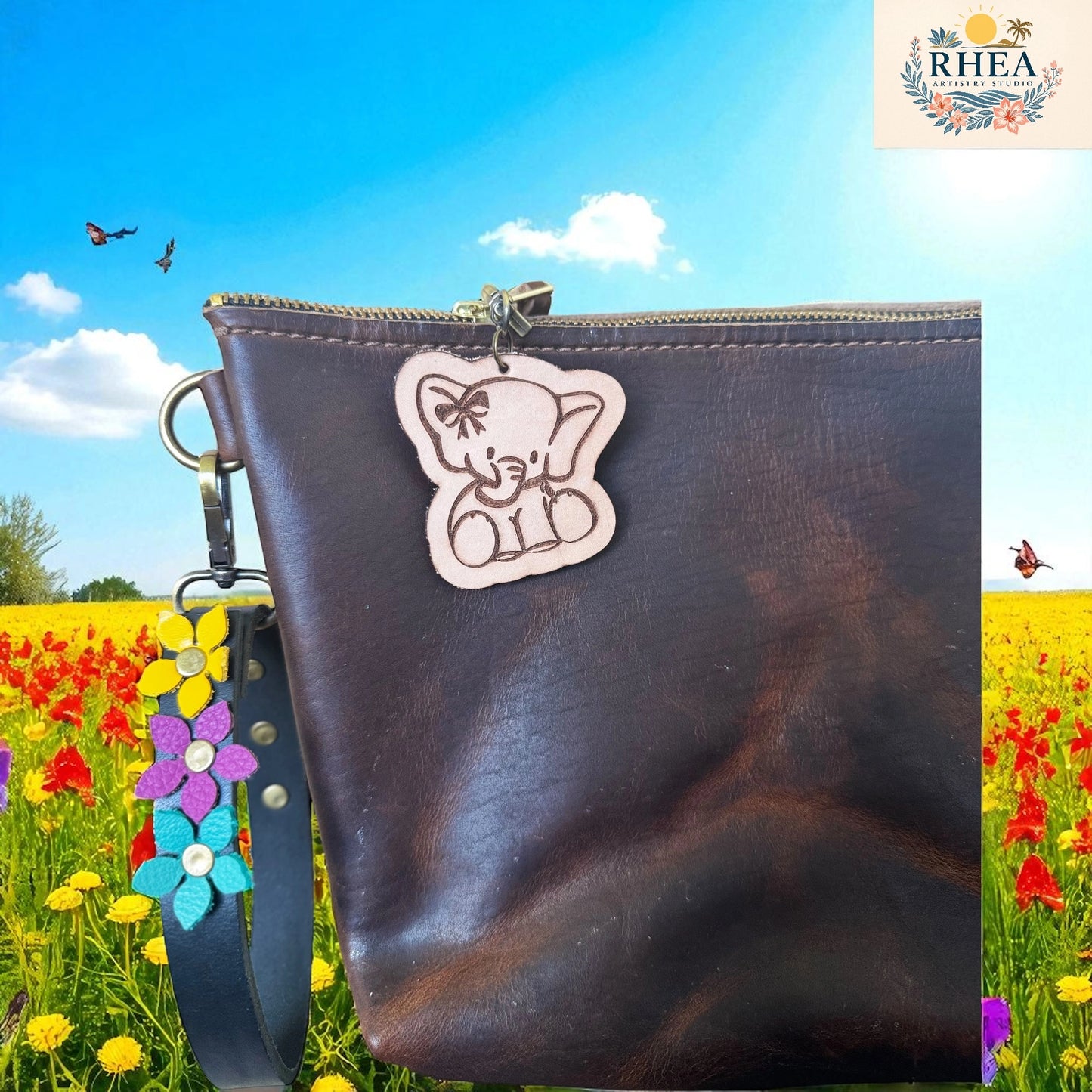 Brown leather pouch with a bear charm against a colorful field background