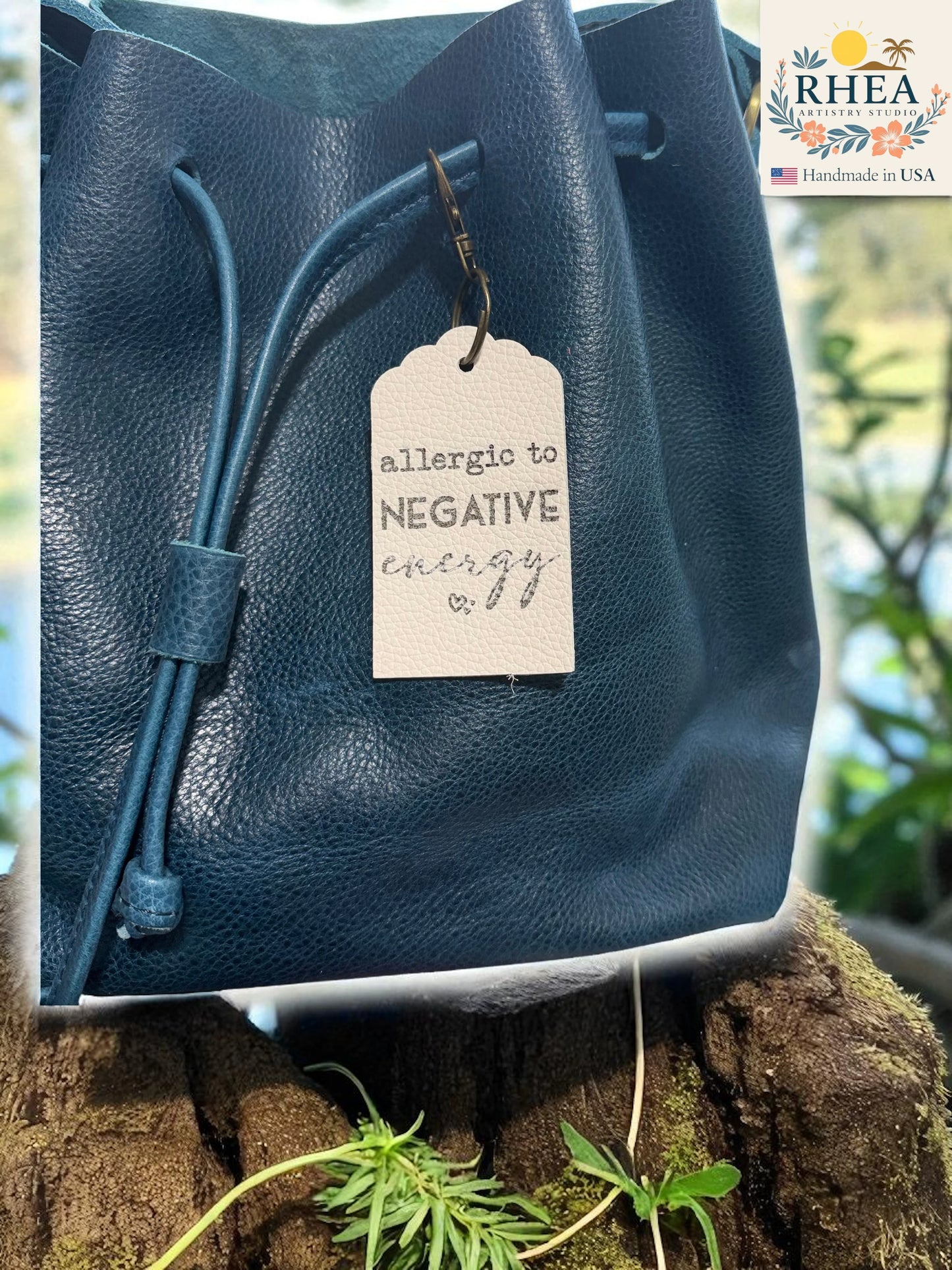 Blue leather bag with a tag on a natural background