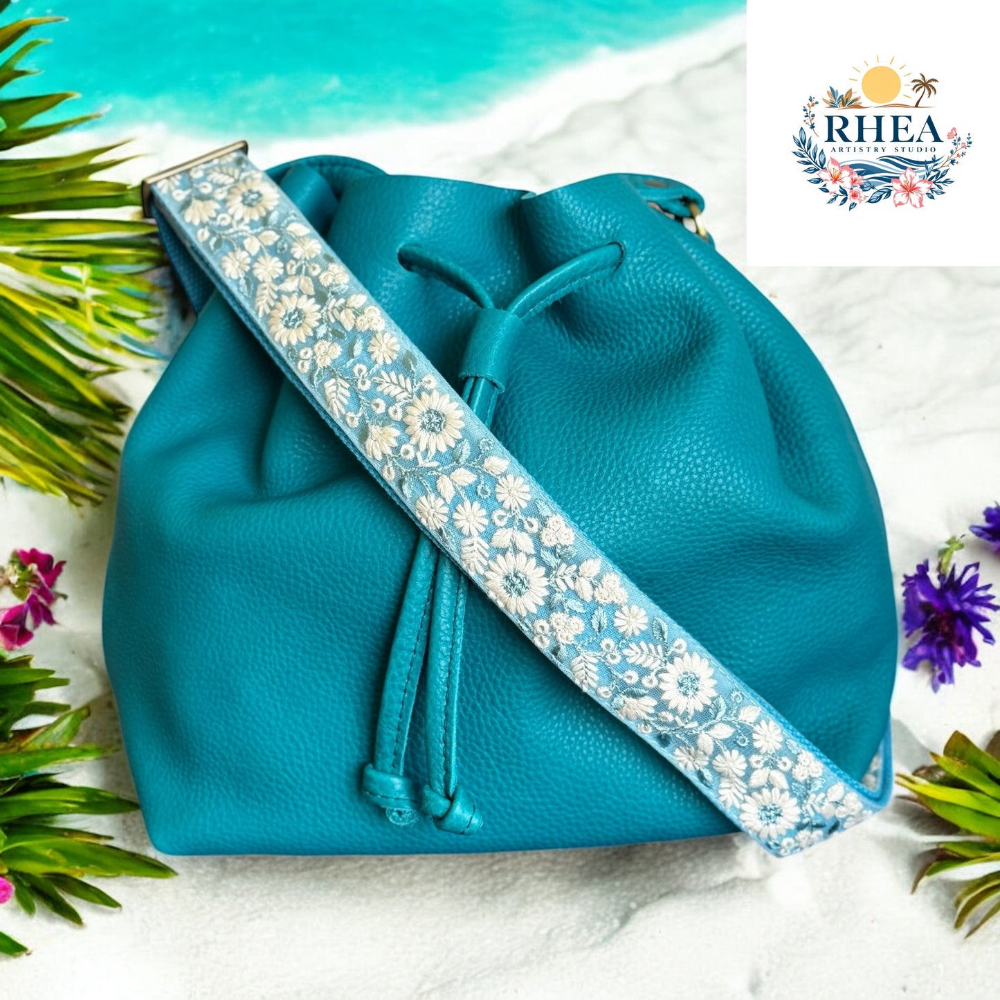 Handcrafted aqua floral handbag strap with ivory embroidery, 1.5-inch wide crossbody style with a soft fabric base. Ideal for summer bags and coastal-inspired fashion.