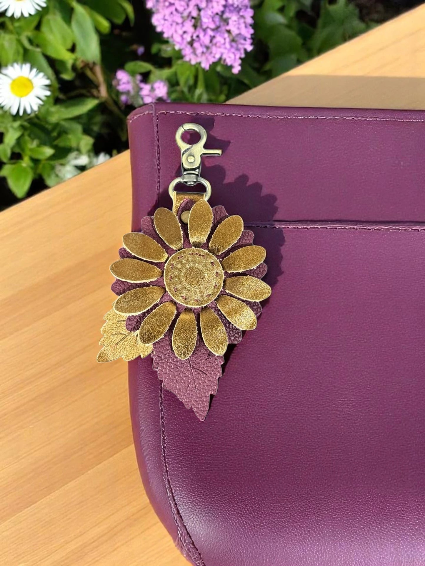 Metallic bronze and plum leather flower charm with layered leaf detail