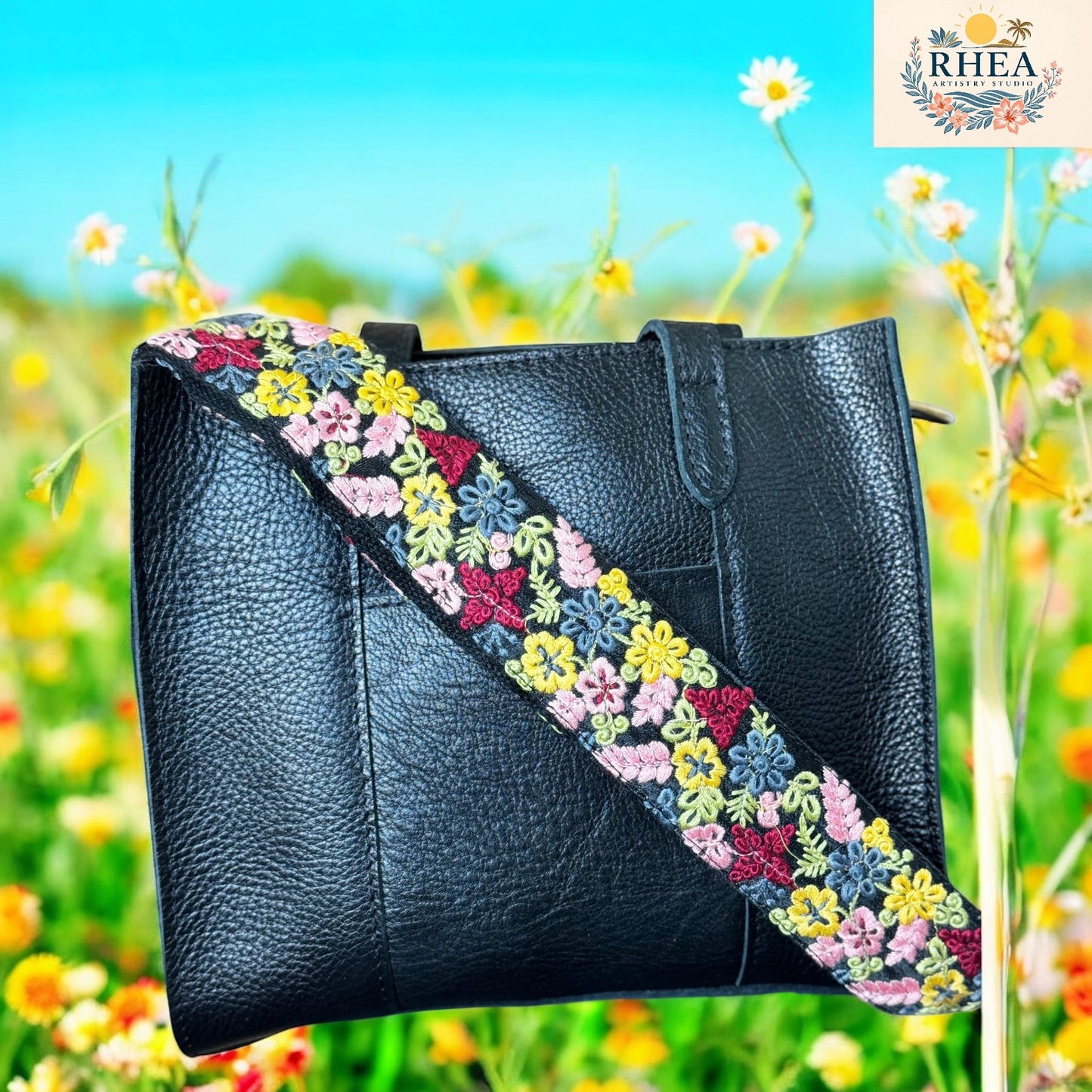 2-inch floral strap with yellow, blush pink, and blue floral embroidery on black base