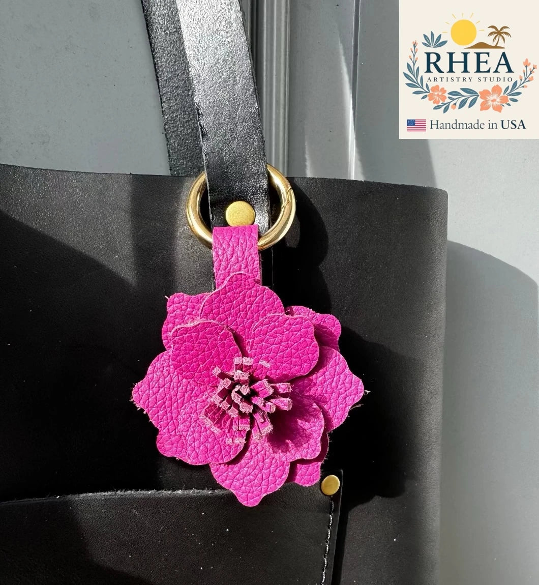 Handcrafted Everbloom Leather Flower Large in Hibiscus and Pink Peacock, styled as a bold leather purse charm.
