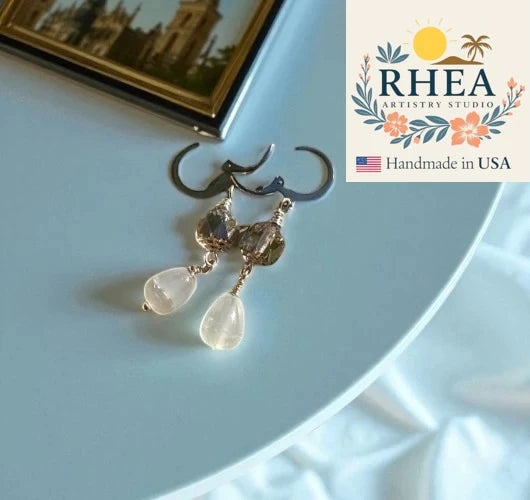Pale blue earrings silver drop handmade with Rhea brand visible