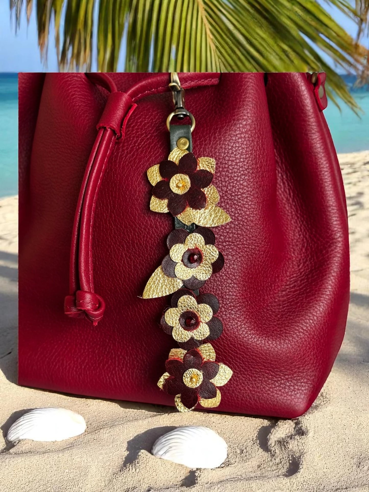 Cascading LeatherCharm with hand-sewn red and gold flowers