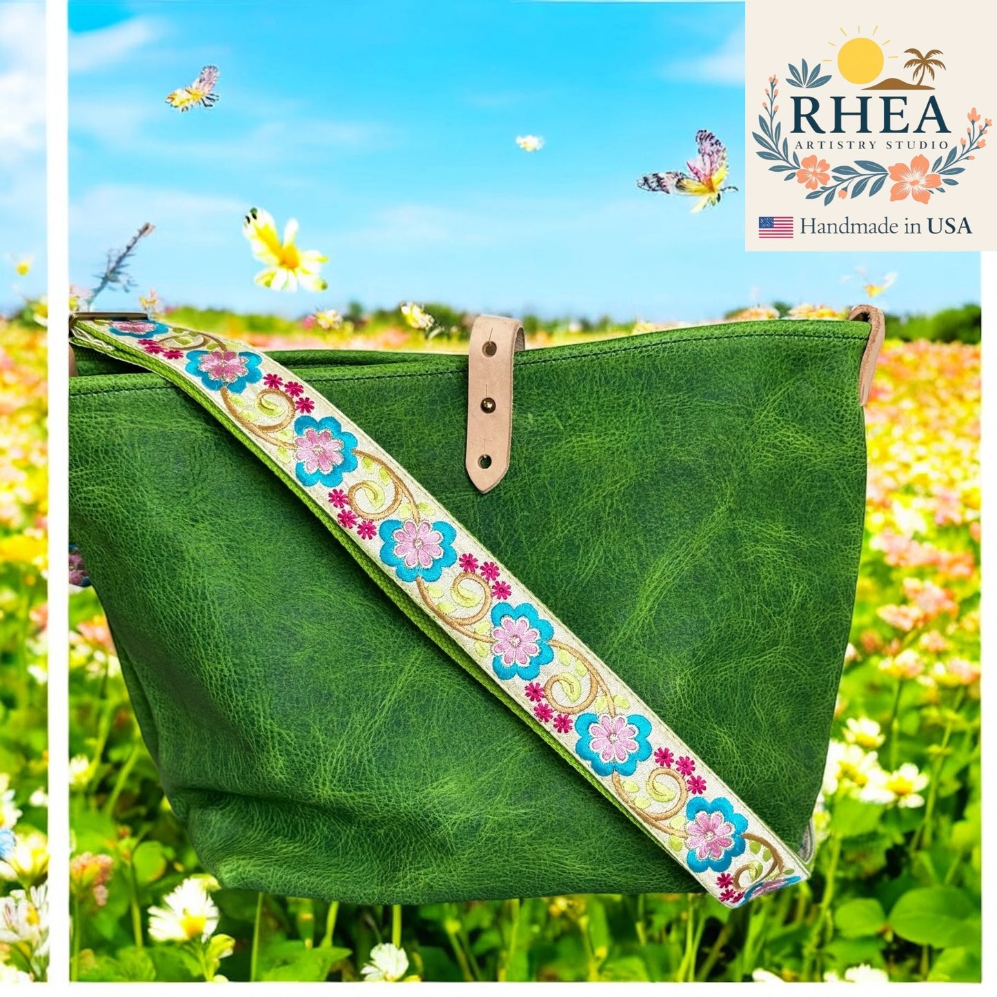 Green bag with floral purse strap against a scenic background, featuring the RHEA brand.