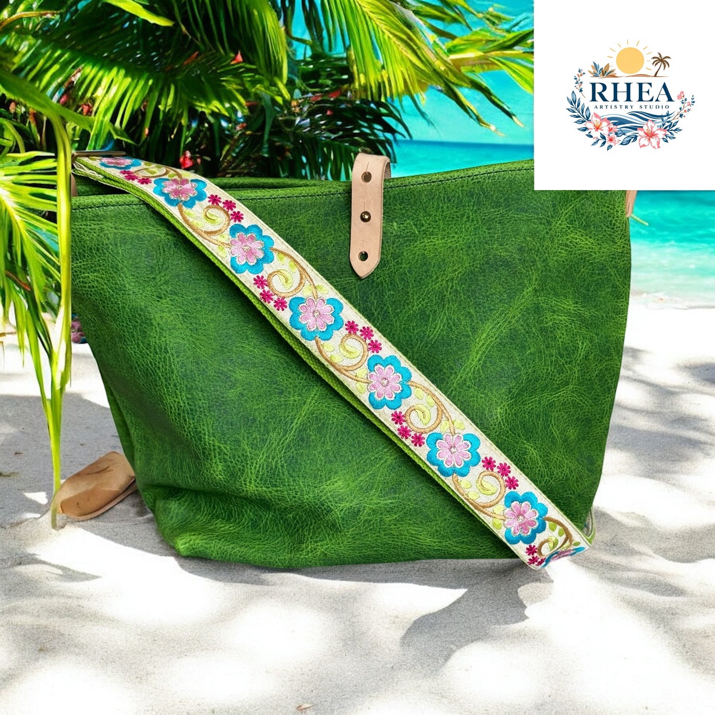 A vibrant lime green replacement strap featuring bold embroidered flowers in blue, pink, and fuchsia, finished with golden vine accents. Styled with a matching green leather handbag against a tropical beach
