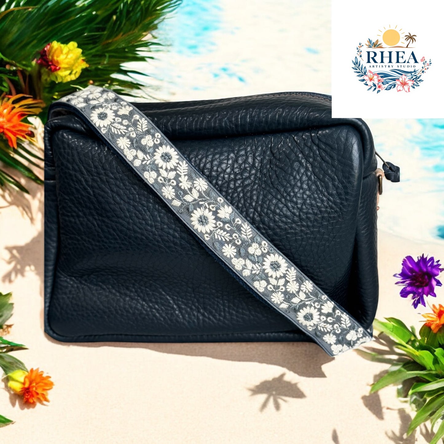 Elegant navy and ivory handmade floral embroidered crossbody strap with fabric base. Ideal for upgrading tote bags, camera bags, or crossbodies with a modern artisan touch. Rhea Artistry Studio strap for women who love bold yet neutral style. Keywords: handmade crossbody strap, navy ivory bag strap, boho camera strap, artisan floral purse strap.