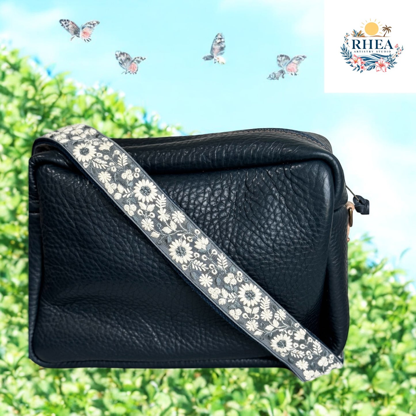 Elegant navy and ivory handmade floral embroidered crossbody strap with fabric base. Ideal for upgrading tote bags, camera bags, or crossbodies with a modern artisan touch. Rhea Artistry Studio strap for women who love bold yet neutral style.