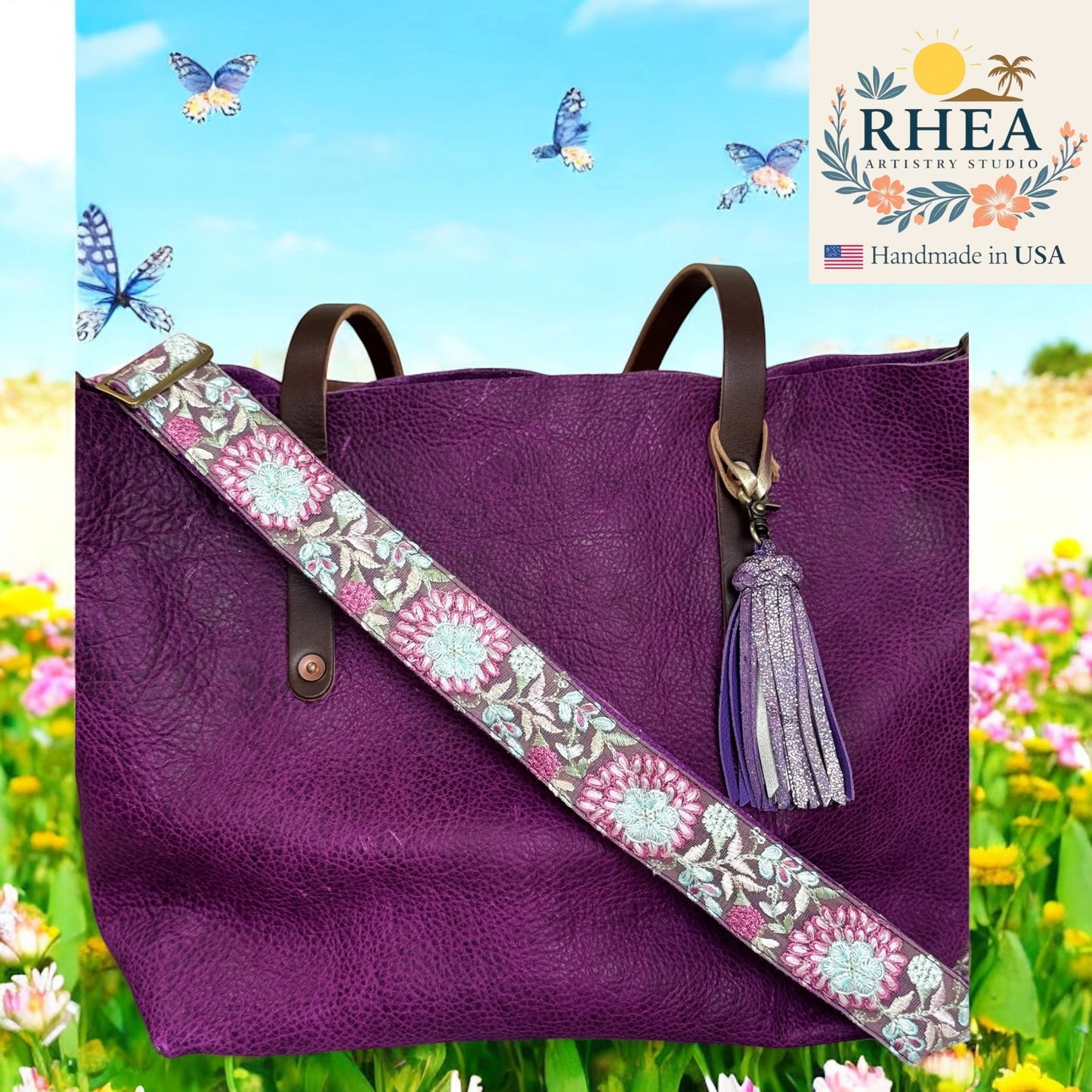 Purple handbag with a floral purse strap and tassel against a colorful background with flowers and butterflies, featuring the RHEA Artistry Studio logo.