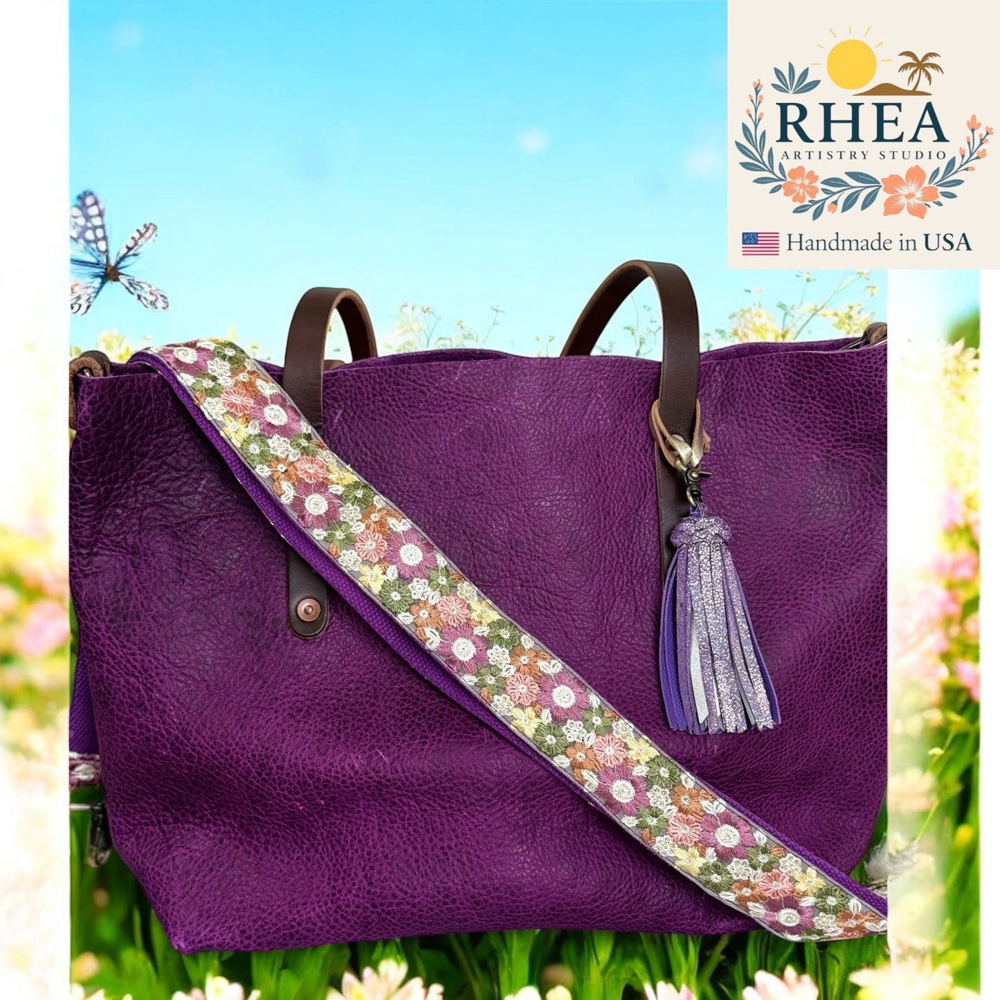 Purple handbag with floral purse strap and tassel, set against a nature-themed background with 'RHEA Artistry Studio' branding.