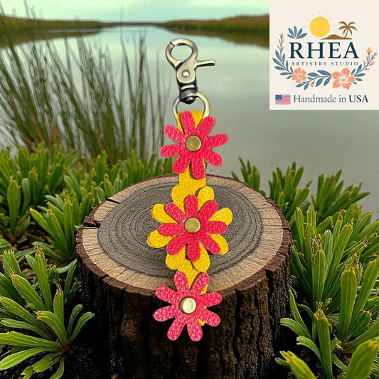 Floral leather bag charm on a wooden stump with a natural background