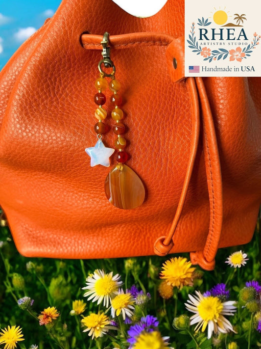 Rhea Artistry Studio handmade agate and moonstone star bag charm with teardrop pendant, 5 inches long.