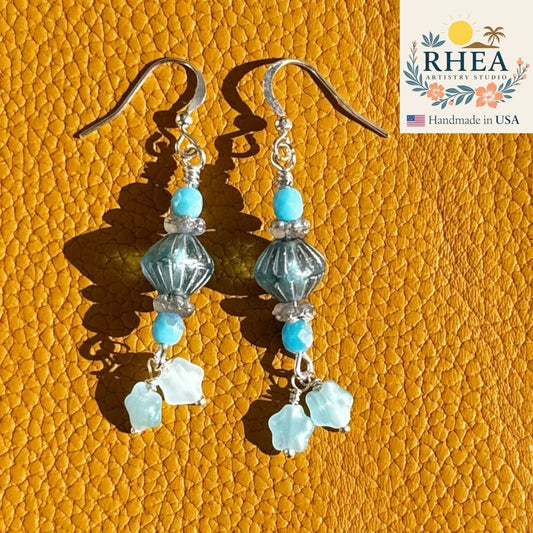 Rhea Artistry Studio aqua and seafoam Czech glass drop earrings with petite star accents, silver-toned findings, approx. 1.5-1.75 inches.
