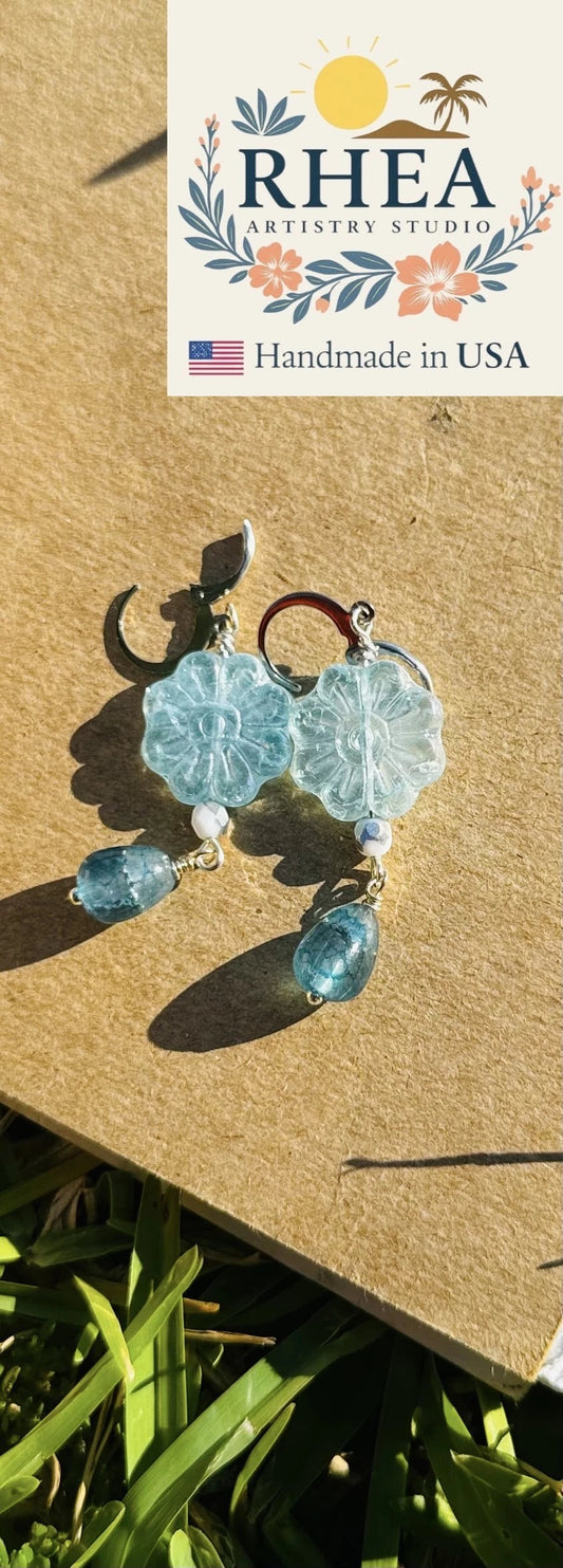 Rhea Artistry Studio blue Czech glass flower drop earrings with silver lever backs and teardrop accents.