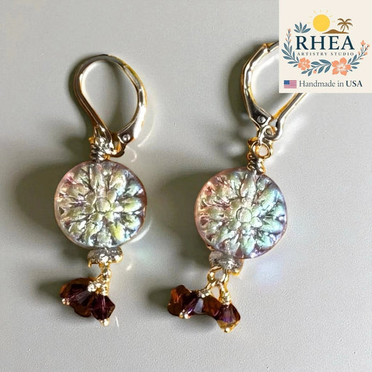 Rhea Artistry Studio Celestial Bloom Earrings: iridescent floral coin beads with plum crystal accents, silver-plated lever-backs, 1.5 inches.