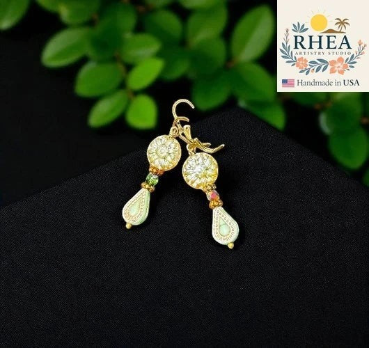 Rhea Artistry Studio green dahlia floral glass earrings with gold accents and green bead drops, approx. 1.5-2 inches long.