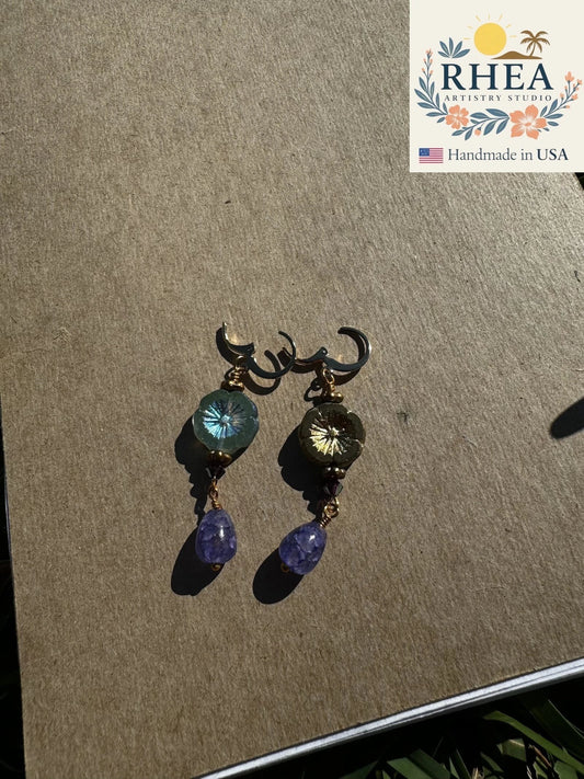 Rhea Artistry Studio hibiscus violet drop earrings with 24k gold plated brass, Czech glass, and amethyst gemstones.