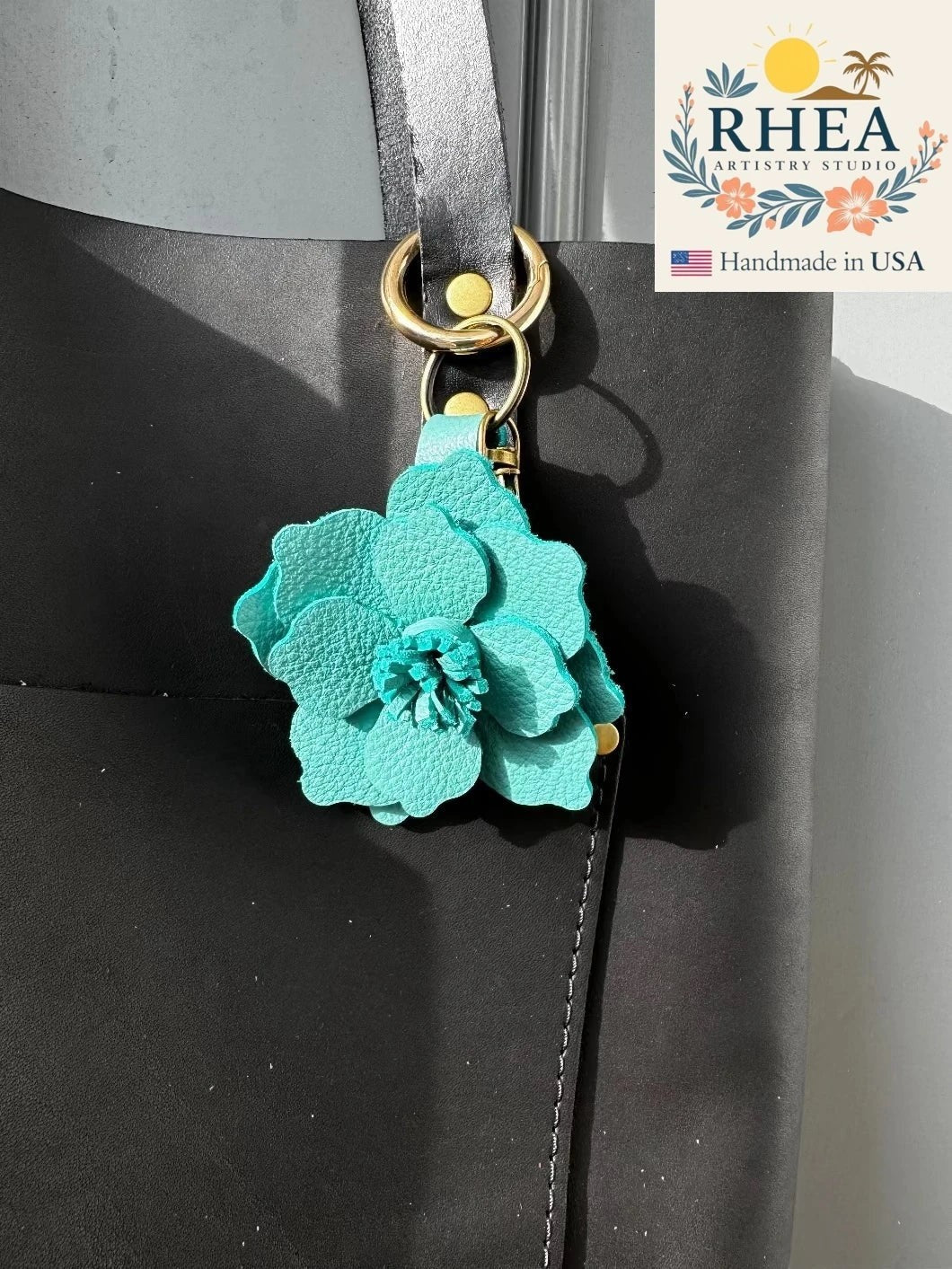 Rhea Artistry Studio ocean teal leather flower charm with lobster clasp and split ring.