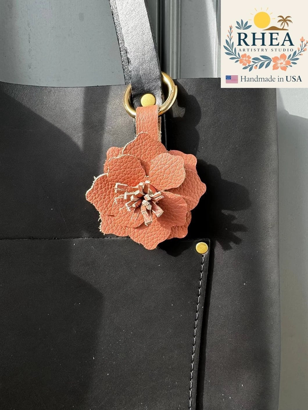 Rhea Artistry Studio peach leather flower charm with tan and pink hues, featuring hand-cut stamens and a versatile closure.