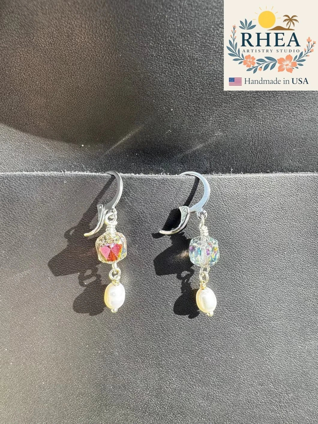 Rhea Artistry Studio silver-plated pearl drop earrings with faceted glass beads, approx. 1.5 inches long.