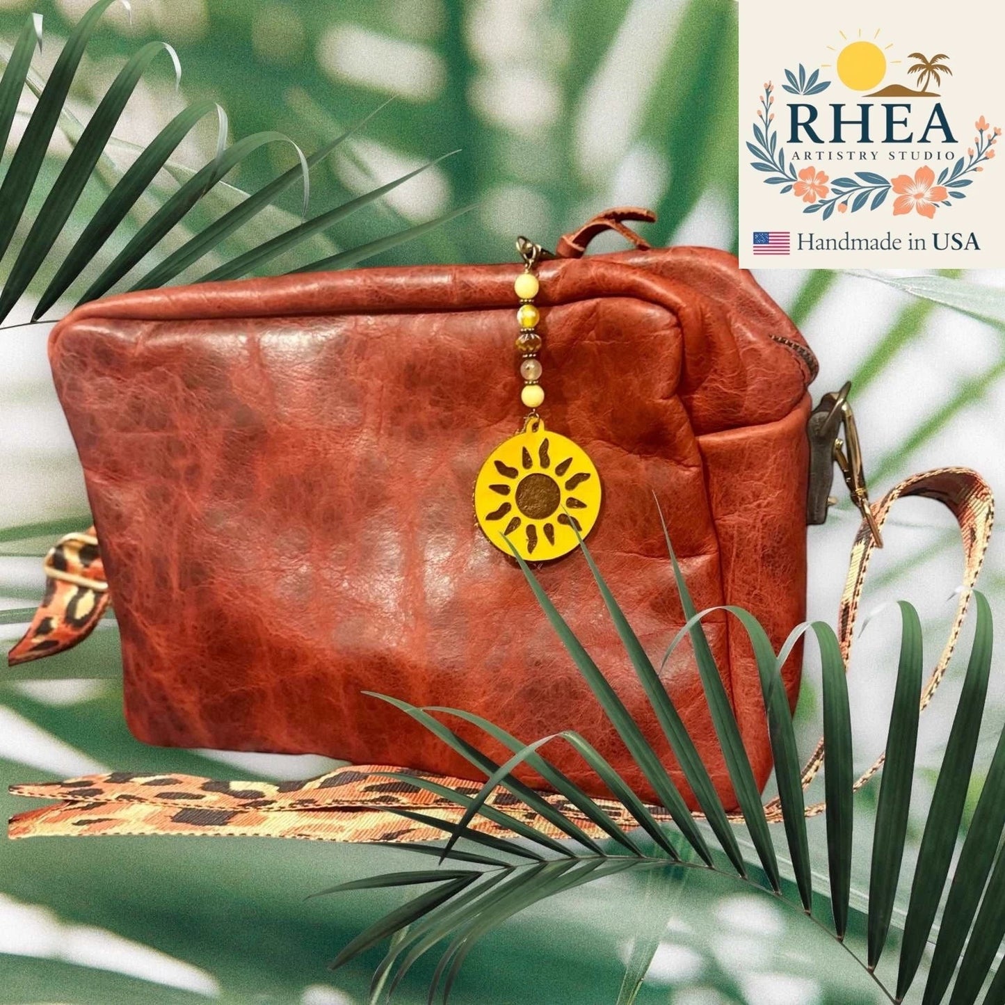 Rhea Artistry Studio handmade sun charm bag accessory with yellow gemstone and Czech glass beads, and leather sun pendant.