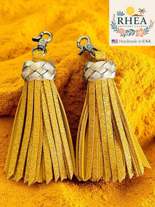 Rhea Artistry Studio handmade yellow glitter leather tassel keychain with antique brass lobster clasp.