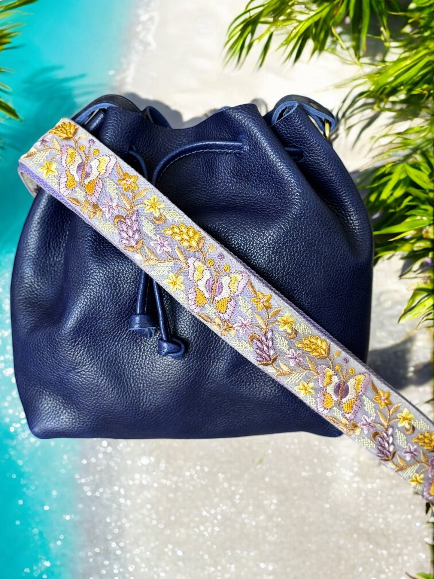 purple strap on a purple bag