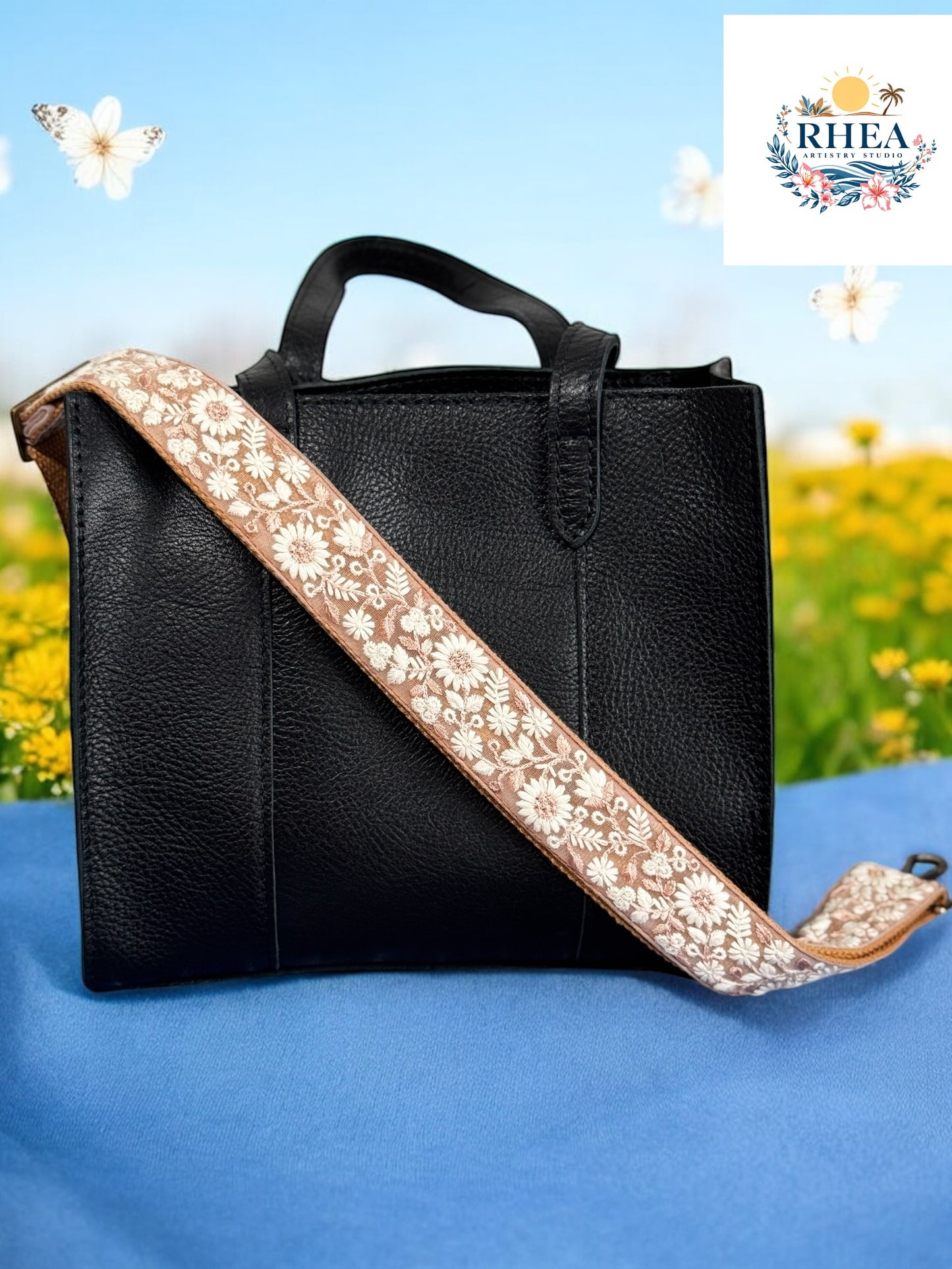 Minimalist taupe crossbody strap featuring delicate ivory floral embroidery, ethically made with a comfortable fabric backing. Great for purses and totes.