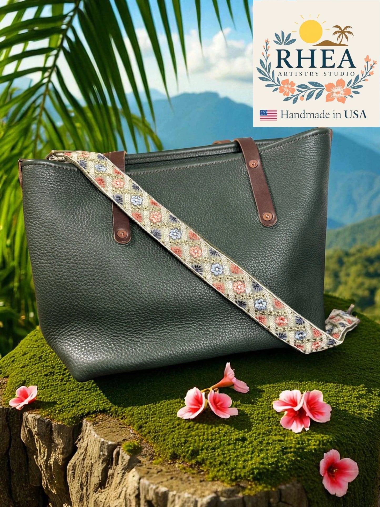 Green handbag with a floral strap on a natural background, featuring the Rhea Artistry Studio logo.