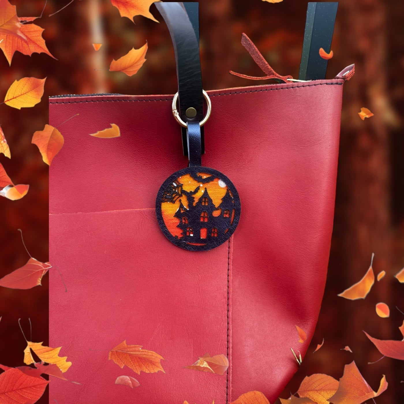 handpainted haunted house with bats and moon on a vegetable tan leather with lobster clasp