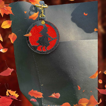 Handcrafted Black Leather Witch Charm with Orange Metallic Background & Lobster Clasp