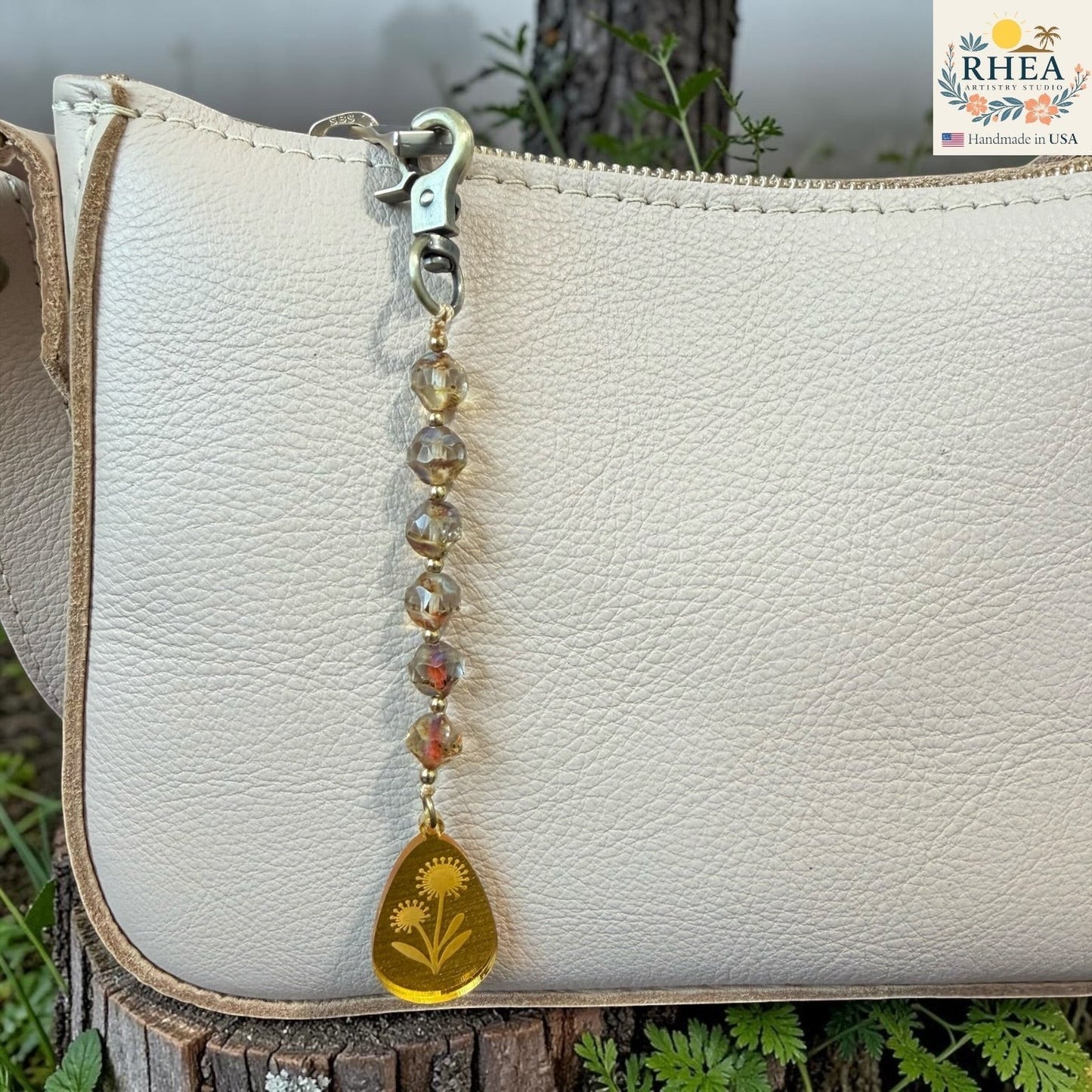 Champagne prism bag charm with floral engraved pendant and light-catching beadwork - bag charm