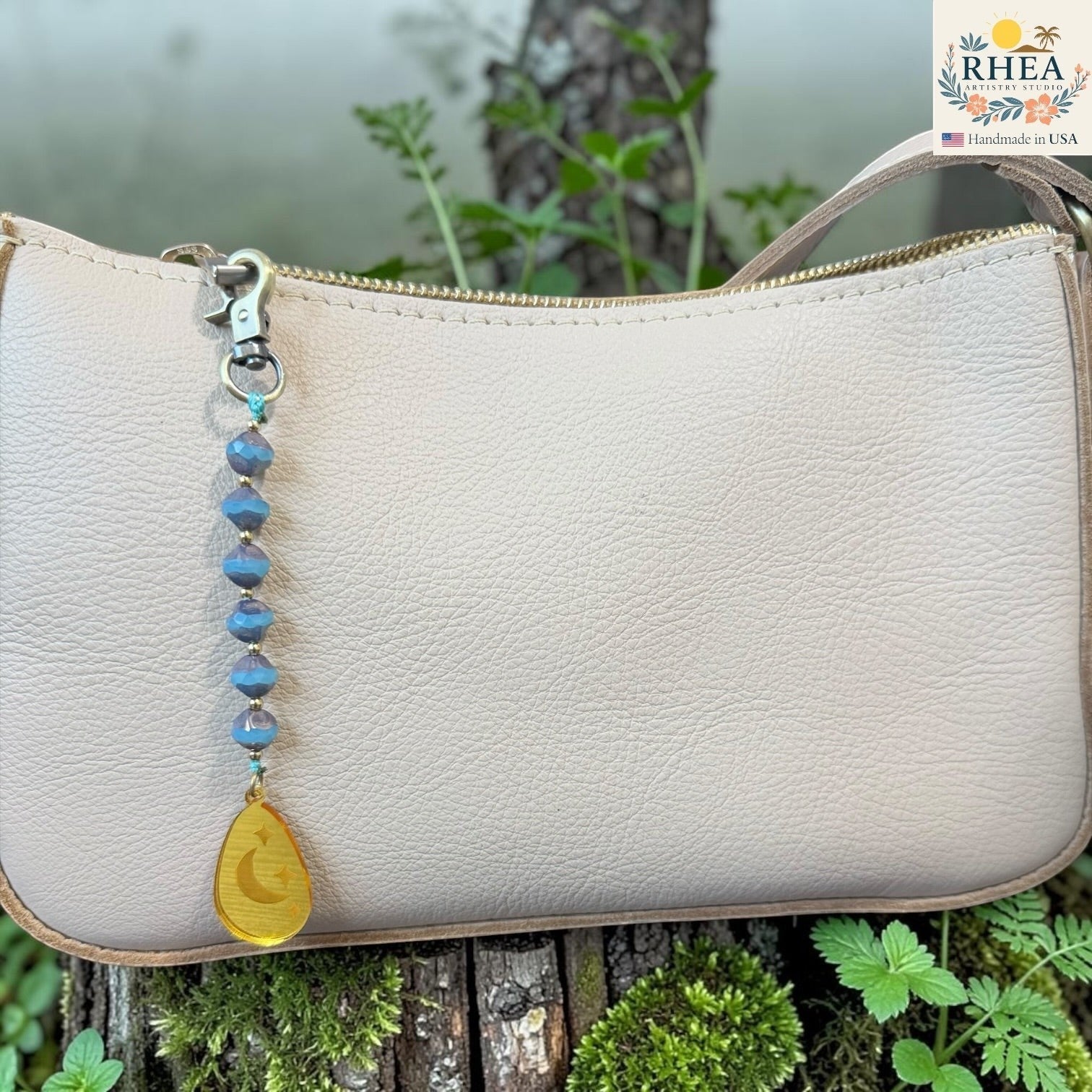 Blue moon bag charm with handknotted beadwork and engraved pendant