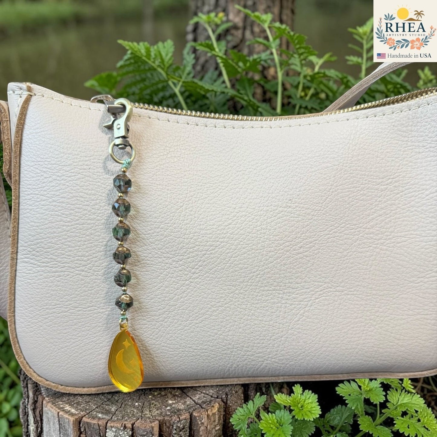Beaded bag charm collection with celestial and nature-inspired pendant motifs