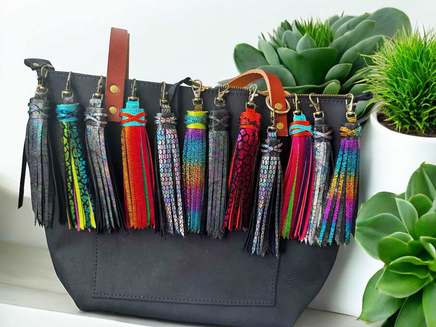 Image of a handbag with different leather tassels 