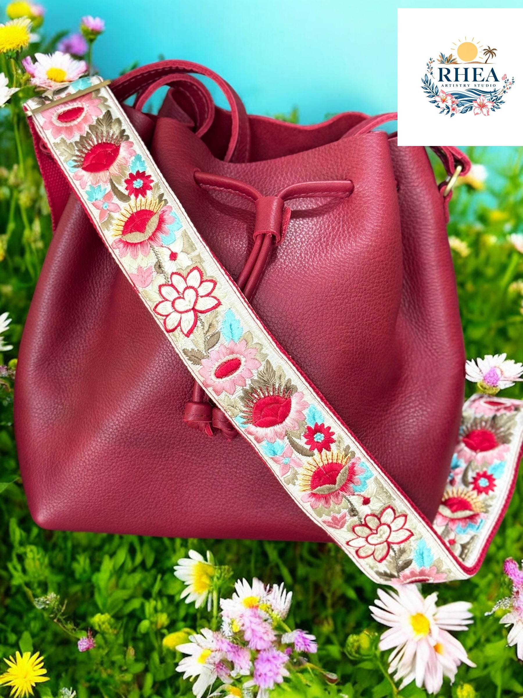 Ethically crafted embroidered replacement purse strap in red featuring intricate sunflower motifs on a cream background.