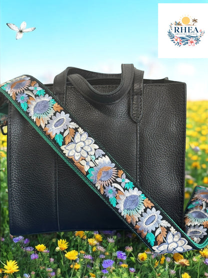 Ethically crafted embroidered replacement purse strap in sea foam green featuring intricate sunflower motifs on a black background.