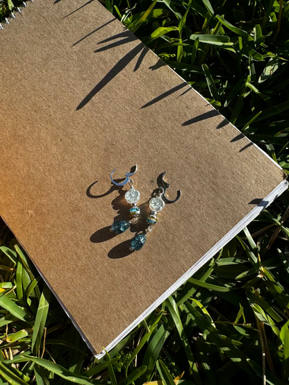 Pair of earrings on a old book