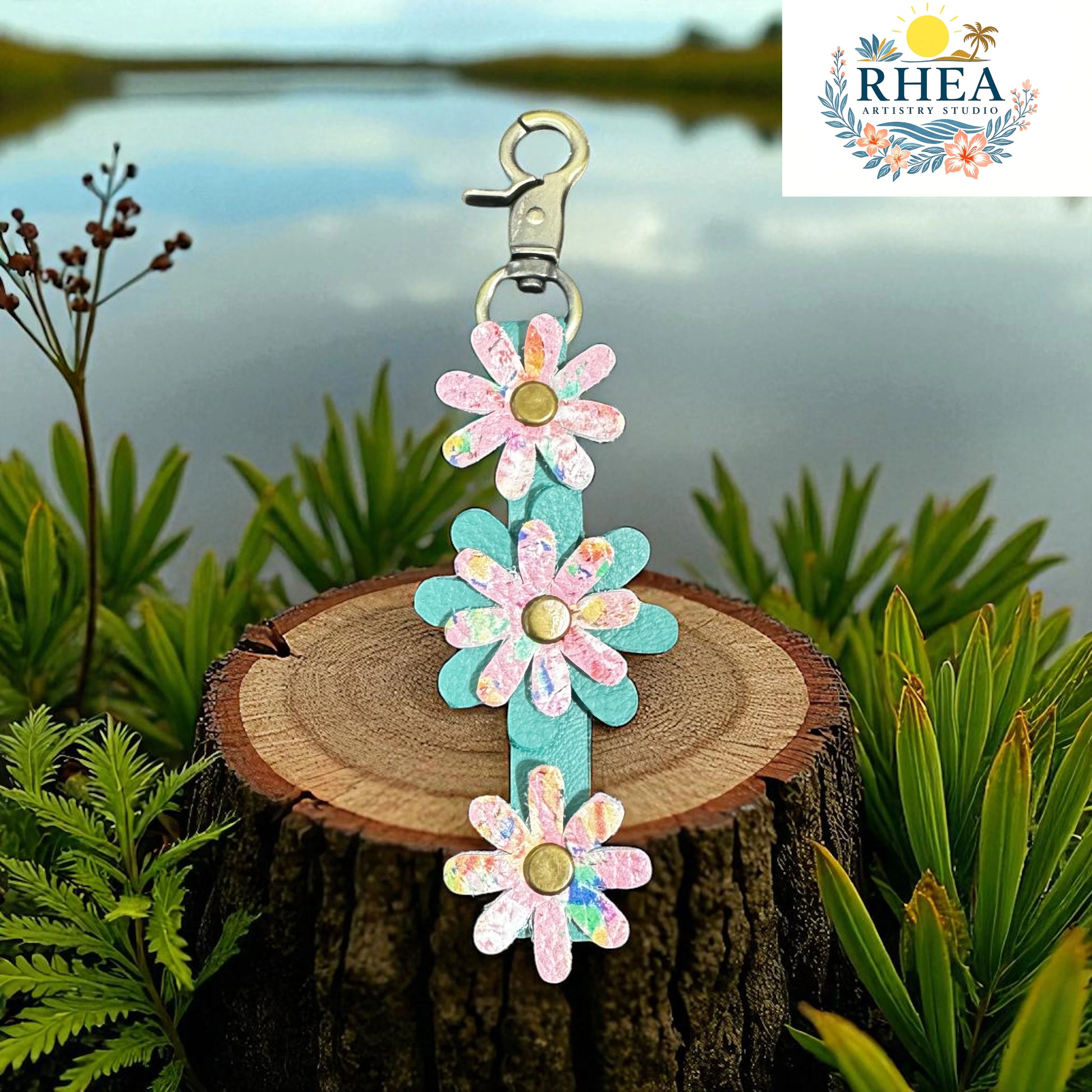 Floral keychain on a wooden stump with a blurred natural background