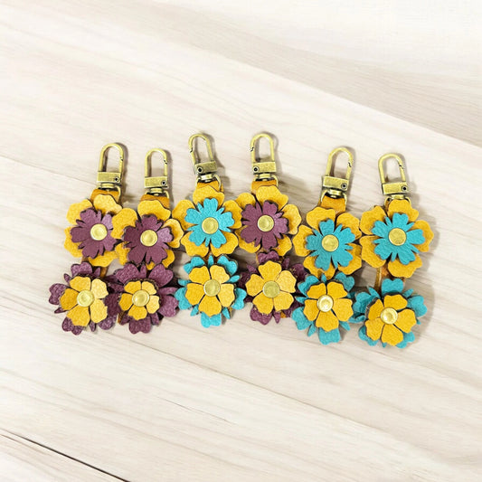 Collection of stacked leather flowers in multiple colors
