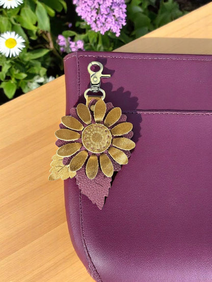 Metallic bronze and plum leather flower charm with layered leaf detail