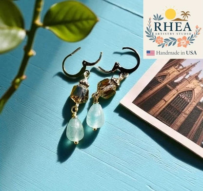 Handcrafted Cathedral Light Blue Silver Drop earrings featuring Czech beads, artisan-made with a delicate design.