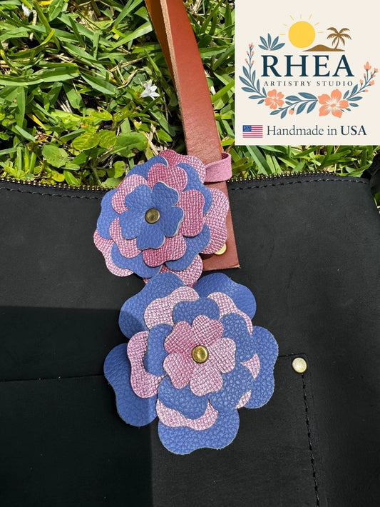 Handcrafted Everbloom Leather Flower Double in Blue Bell and Barbie Pink, styled as a playful leather purse charm.