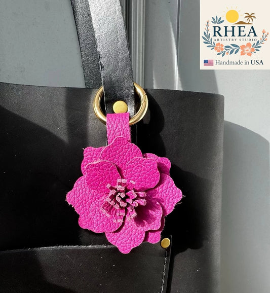 Handcrafted Everbloom Leather Flower Large in Hibiscus and Pink Peacock, styled as a bold leather purse charm.