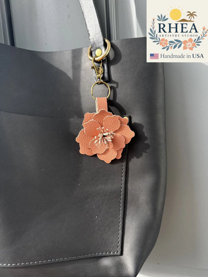 Handcrafted Everbloom Leather Flower Small in Peach Fizz, styled as a soft leather purse and bag charm.
