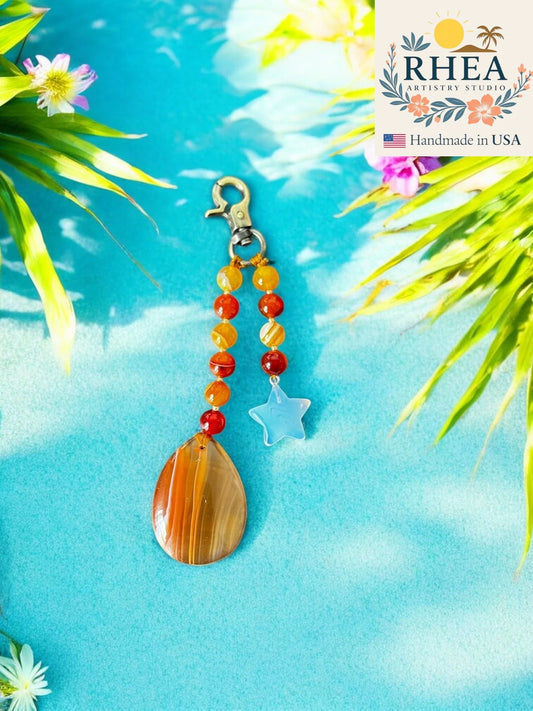 Handcrafted Fiery Gemstone Bag Charm featuring an agate pendant and moonstone star, artisan-made 5-inch beaded accessory for bags and purses.